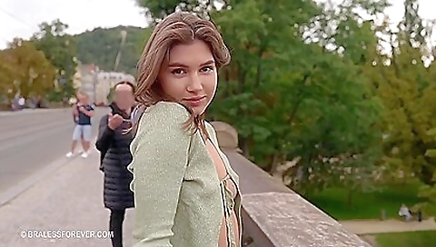 Outdoor solo sex with a sexy brunette in a white blouse