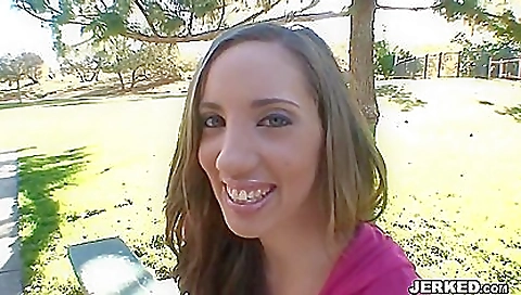 Busty brunette girl in a bikini with tattoo on her body