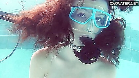 Emi gets a wet pussy while on the beach on a beach