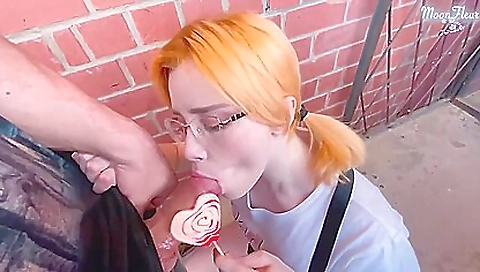 Busty redhead teen gets a facial in the rain outdoor