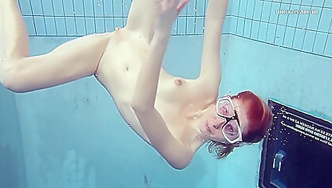 Redhead babe shows off her body in a solo video video