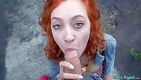 Hot redhead on the sofa giving a very exciting blowjob